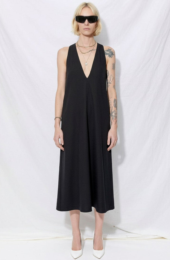 black trapeze dress IN LINEN True Bias Its high halter neckline is elevated with exquisite beadwork that frames the shoulders with sophisticated sparkle Satin Bow Shoulder Trapeze Mini